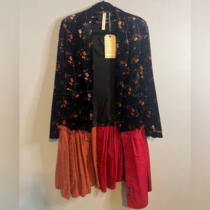 Beautiful blazer. Dress it up or down. One of a kind piece. Fits S/M.